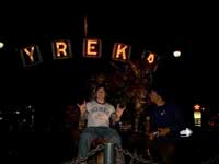 High spirits on the way up. Singer Ricardo and I ham it up on the grizzled prospector statue in Yreka.